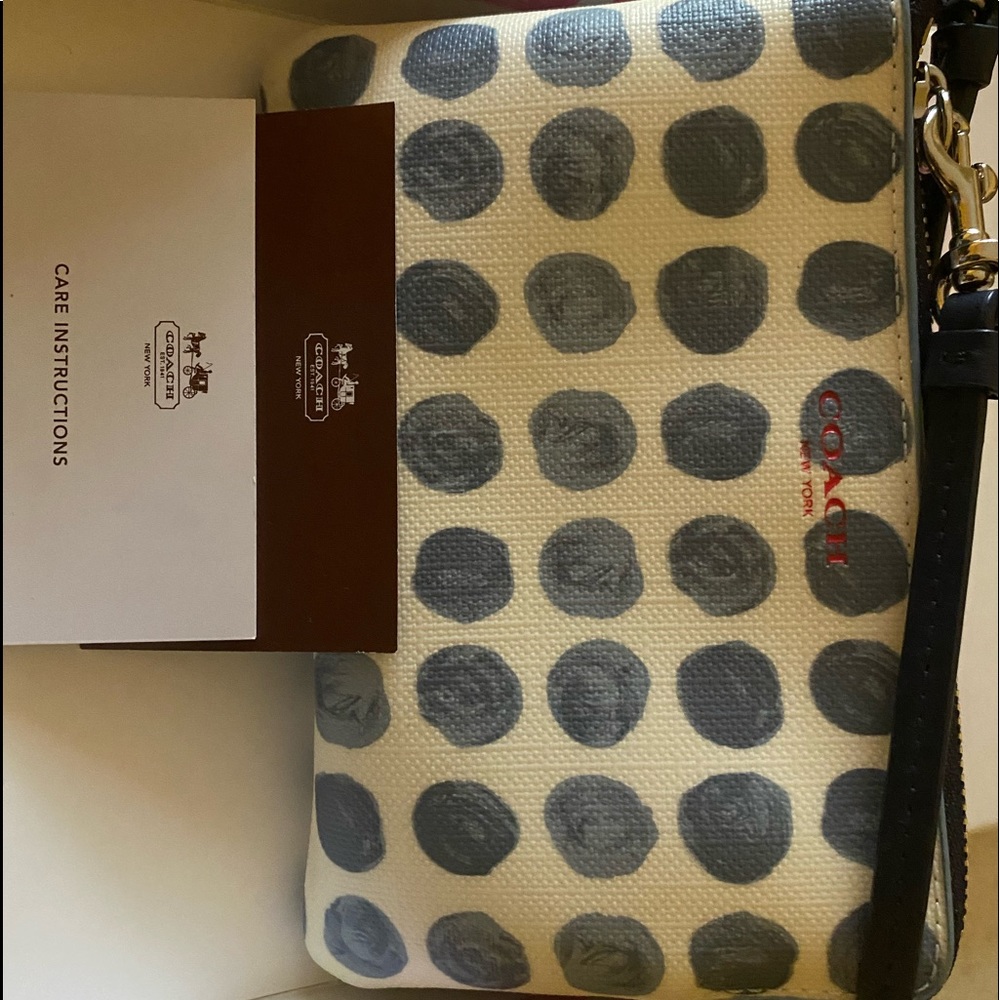 Polka dot Coach wristlet
